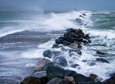 Waves breaking over the Great South Wall at Poolbeg in Co. Dublin.
