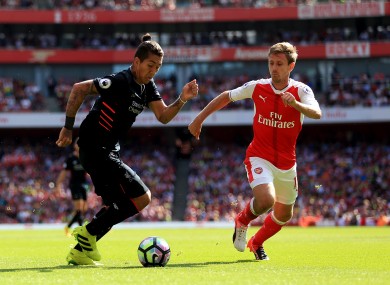 Roberto Firmino and Nacho Monreal when Liverpool and Arsenal met back in August.