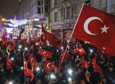 Protesters wave flags outside the Dutch consulate in Istanbul.