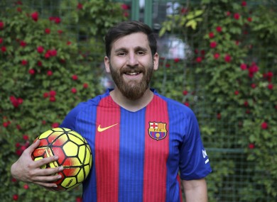 Reza Parastesh Iranian doppelganger or look-alike, of Argentinian superstar Lionel Messi, poses for a photo in an urban soccer field in Tehran.