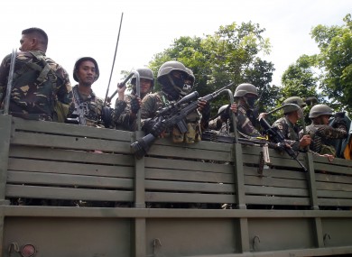 Philippine government troops are shipped in to fight the militants.