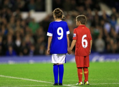 A young Everton and Liverpool fan pay tribute to the 96 people who died in the Hillsborough tragedy.