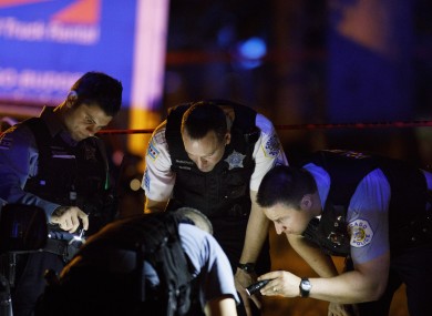 Police work the scene where one person was shot on the 5500 block of South Throop Street in Chicago.