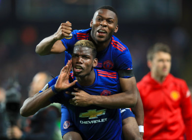 The defender celebrating United's Europa League win with Paul Pogba.