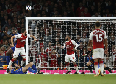 Arsenal's Olivier Giroud, left heads the ball to score his sides 4th goal of the game.