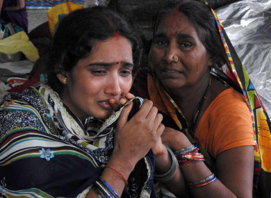 Relatives mourn the death of a child at Baba Raghav Das Medical College Hospital in Gorakhpur, in the northern Indian state of Uttar Pradesh.