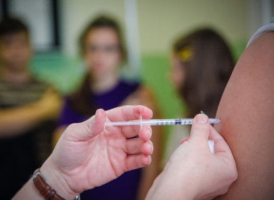 Health Minister Simon Harris said his department is still considering the roll out of a vaccination compensation programme.