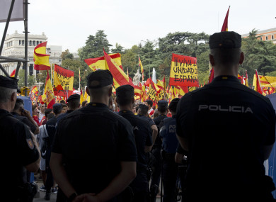 Thousands of pro-Spanish unity supporters donning Spanish flags have rallied in a central Madrid plaza to protest against the Catalonia independence vote.