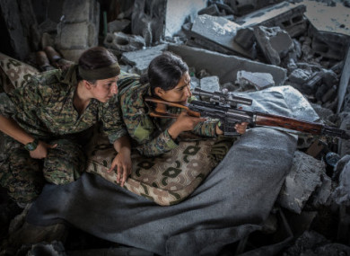 Soldiers of the Women's Protection Units (YPJ) targeting IS fighters in Raqa.