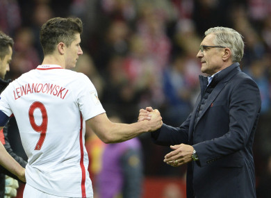 Poland's Robert Lewandowski, left, and coach Adam Nawalka celebrate after winning their last World Cup Group E qualifying match.