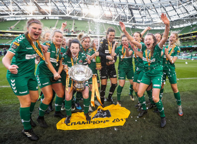The Cork City players celebrate with the trophy.