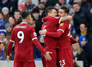 Emre Can celebrates scoring Liverpool's first goal with Dejan Lovren and Roberto Firmino.