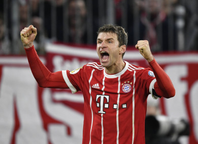 Thomas Müller celebrates scoring against Borussia Dortmund.