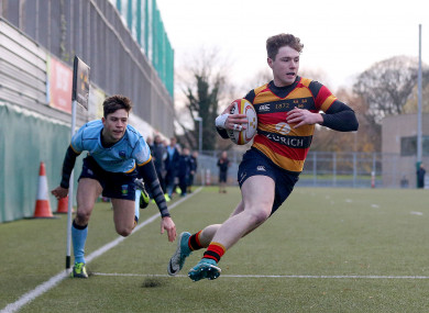 Lansdowne's Mark O'Keefe on his way to scoring a try.