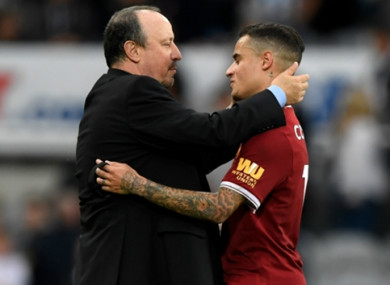 Coutinho (right) pictured in conversation with his former coach Rafa Benitez.