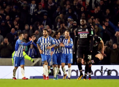 The Brighton players celebrate Murray's winner.