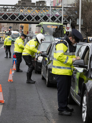A gardai traffic corps stop cars at the Custom House, Dublin.