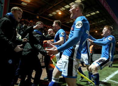 Davis and the Rochdale players celebrate their goal.