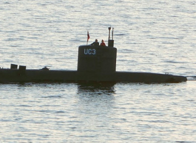 Swedish journalist Kim Wall allegedly stands next to a man in the tower of the private submarine