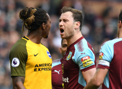 Bong and Burnley's Ashley Barnes exchange words during the game.