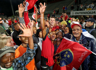 CJ Stander surrounded by both sets of fans after Munster's win on Saturday in George, South Africa.