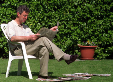 Former Labour leader Dick Spring reads the paper ahead of the 1997 general election.