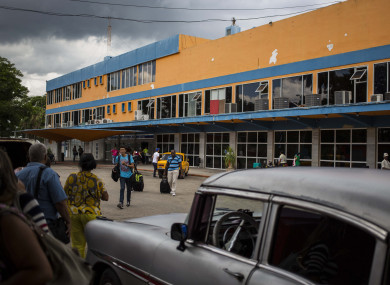 Travellers walk outside Jose Marti International Airport Terminal 1 in Havana.