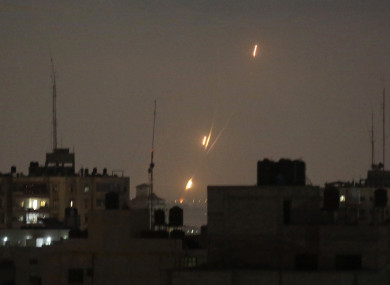 Flames of rockets fired by Palestinian militants are seen over Gaza Strip toward Israeli lands.