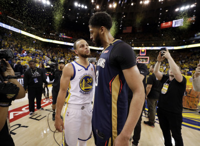Golden State Warriors' Stephen Curry and New Orleans Pelicans' Anthony Davis after their game.