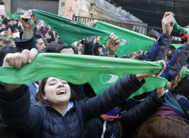 Women celebrate the approval of the bill in Buenos Aires.