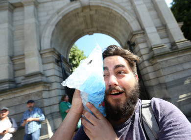 Benjamin Jourdan from France cools off using a bag of ice last month.