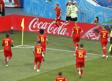 Belgium's Dries Mertens, top, celebrates after scoring the opening goal.