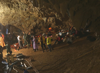 Emergency rescue teams gather in the staging area as they continue the search