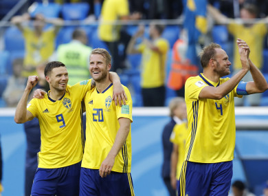 Sweden's players celebrate their team victory over Switzerland.