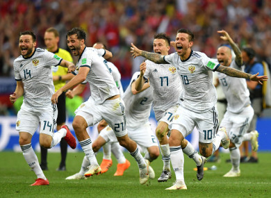 Russian players celebrate following Igor Akinfeev's penalty save.
