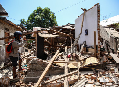 A collapsed house after an earthquake hit on Sunday in North Lombok, Indonesia