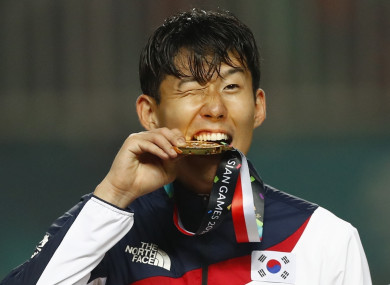 The Tottenham striker pictured with his gold medal on Saturday.