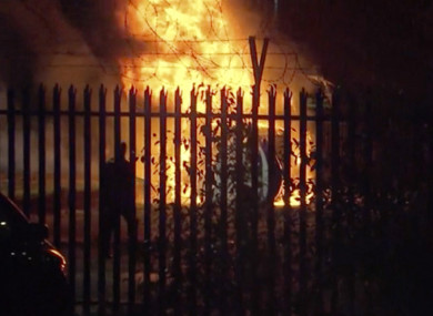 This image made from video shows a burning helicopter in a parking lot outside the King Power Stadium in Leicester.