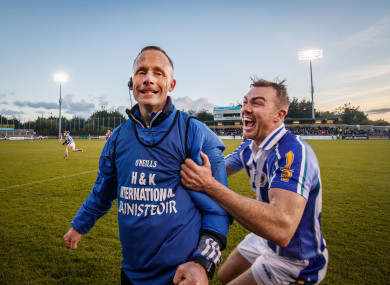 Ballyboden St.Enda’s manager Joe Fortune celebrates at the final whistle with Simon Lambert.