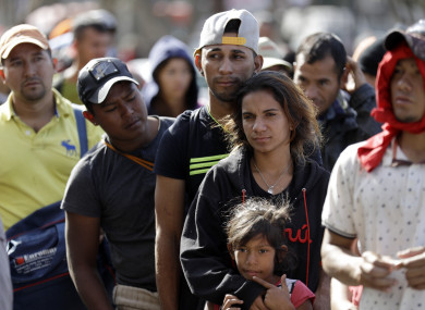 Members of the migrant caravan started to meet some local resistance as they continued to arrive by the hundreds in the Mexican border city of Tijuana