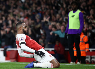 Lacazette celebrates his brilliant finish.