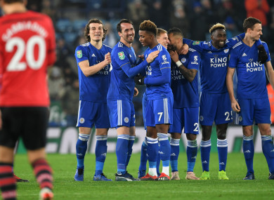 Leicester players celebrates and Southampton's Manolo Gabbiadini walks back after missing a penalty during the Carabao Cup.