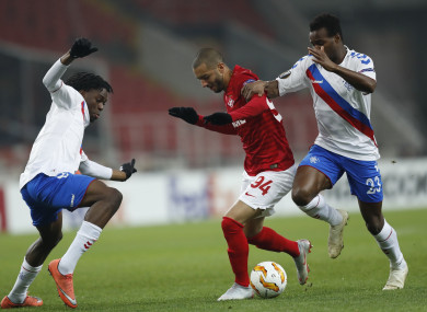 Spartak's Sofiane Hanni, centre, challenges for the ball with Rangers' Lassana Coulibaly, right, and Ovie Ejaria.