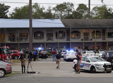 Police investigators work the scene of the shooting