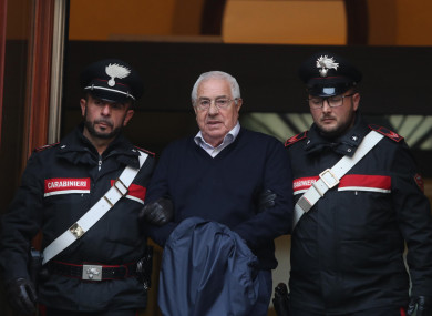 Settimino Mineo, center, who allegedly took over as the Palermo head of Cosa Nostra, is escorted by Italian Carabinieri police after an anti Mafia operation which led the arrest of 46 people including the presumed regional boss.
