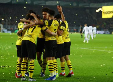 Reus celebrates with his Dortmund team-mates.
