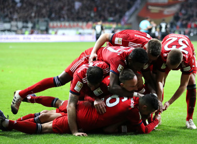 Ribery celebrates his second goal with team-mates.