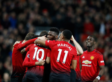 Paul Pogba celebrates with team-mates after giving Man United the lead.