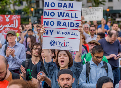 File photo of protesters demonstrating against Trump's travel ban.