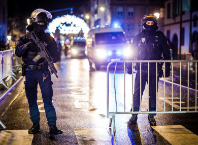 Policemen secure the entrance to the Strasbourg Christmas Market after three people were killed in a shooting attack